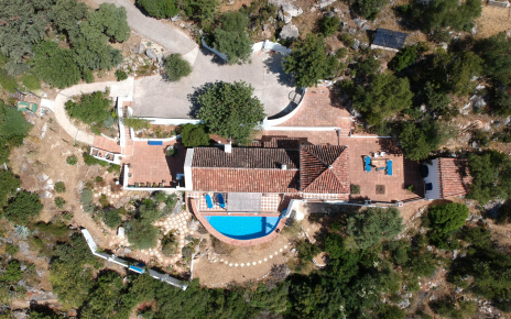 Pool, villa and terraces seen from drone